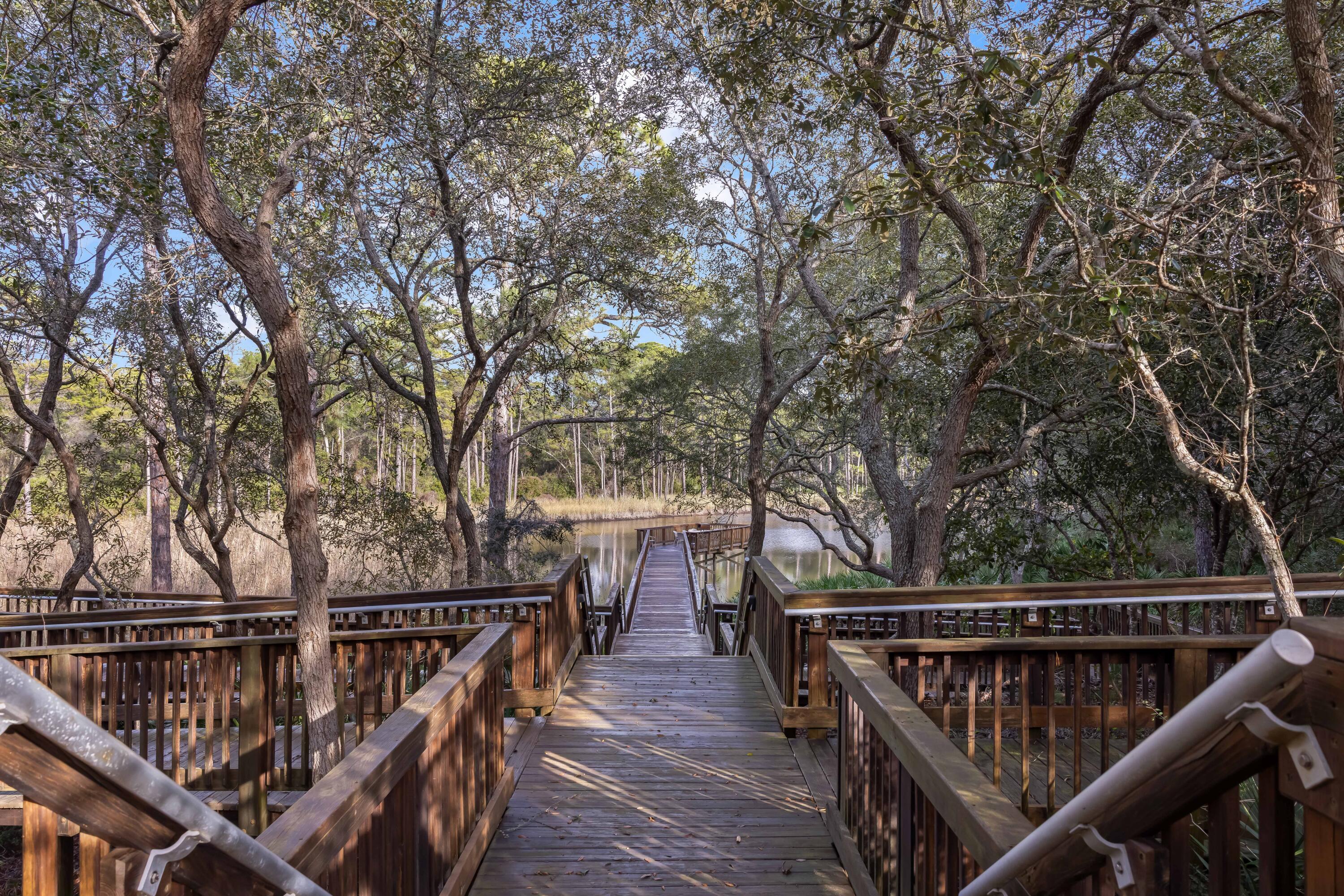 2046 West County Highway 30A, Unit M2428 Santa Rosa Beach, FL 32459 - Photo 60 of 72 a view of balcony with wooden floor and fence