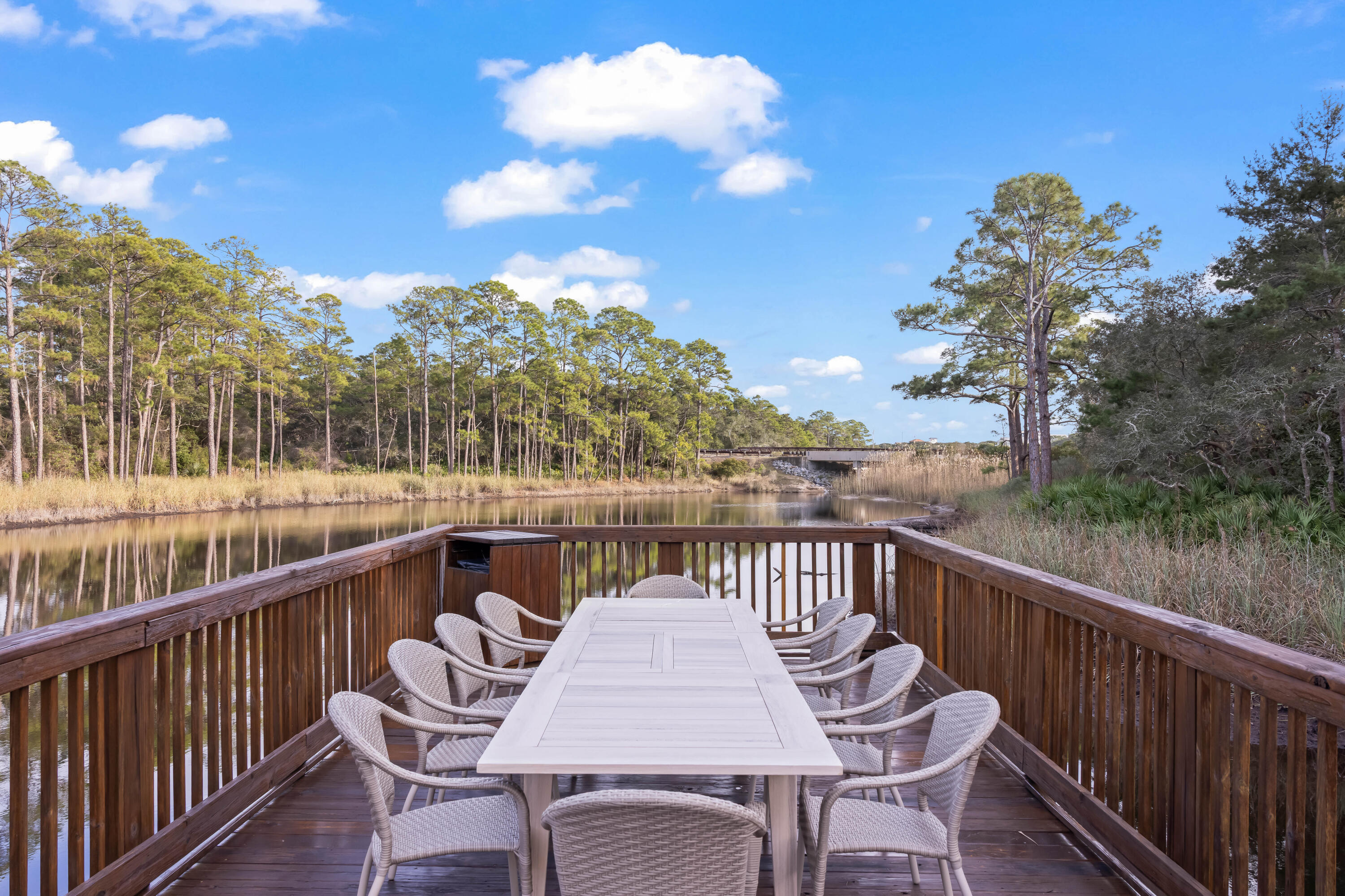 2046 West County Highway 30A, Unit M2428 Santa Rosa Beach, FL 32459 - Photo 62 of 72 a view of a chairs and table on the deck