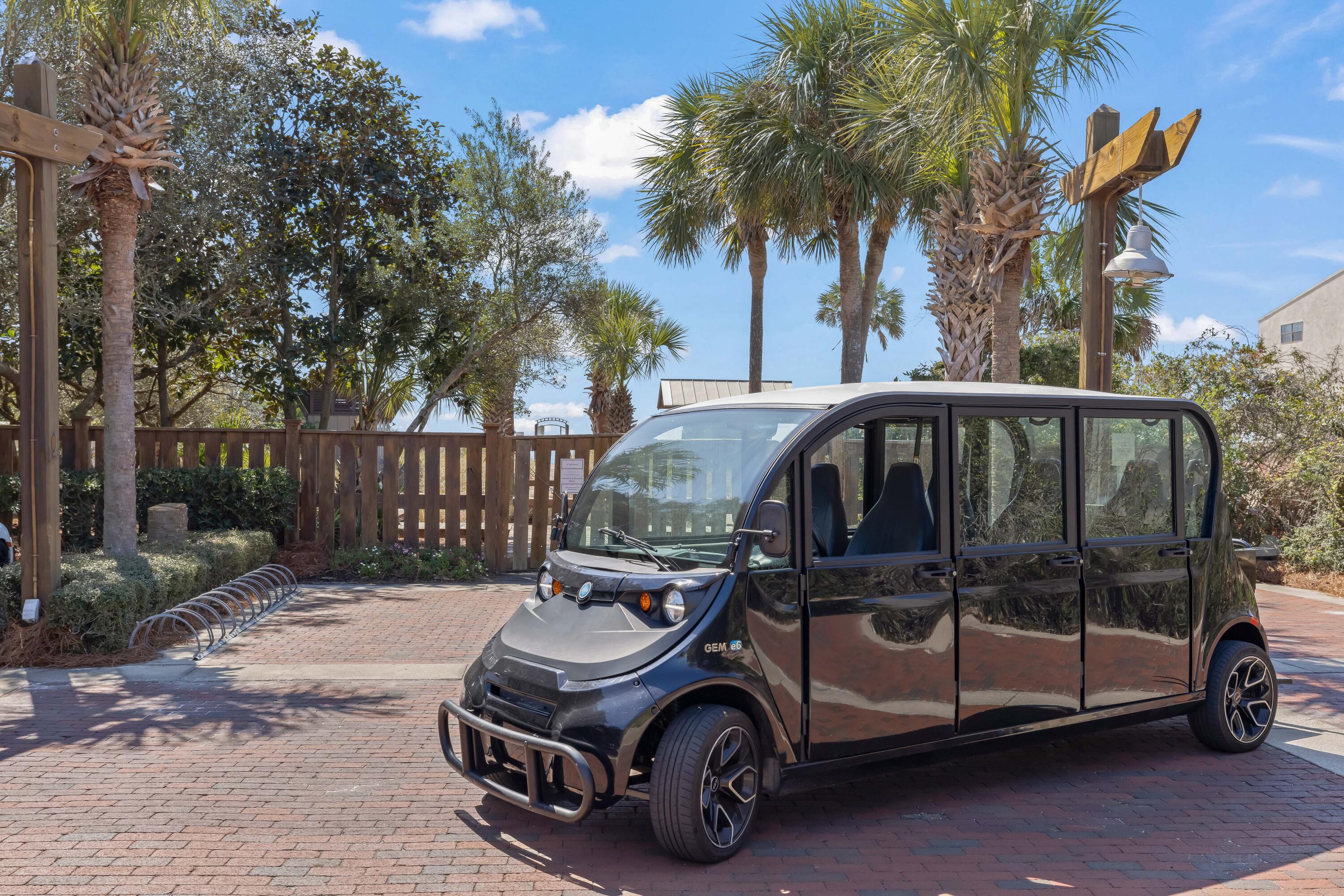 2046 West County Highway 30A, Unit M2428 Santa Rosa Beach, FL 32459 - Photo 64 of 72 a car parked in front of a house with a yard