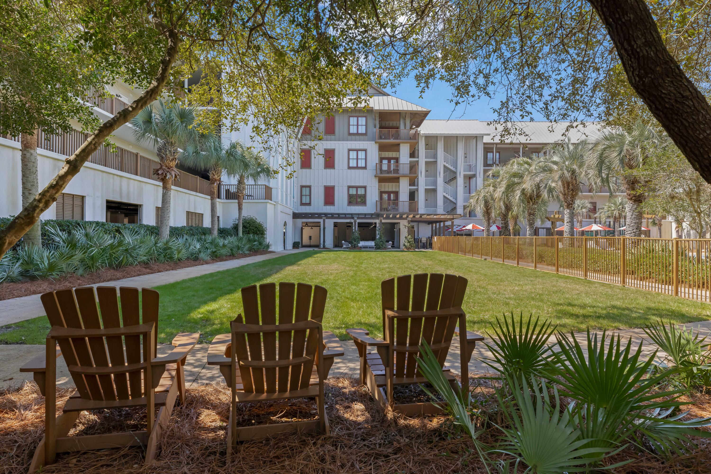 2046 West County Highway 30A, Unit M2428 Santa Rosa Beach, FL 32459 - Photo 71 of 72 a view of a table and chairs in patio