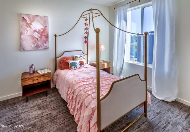 a bedroom with bed and a window