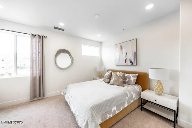 a bedroom with a bed and window