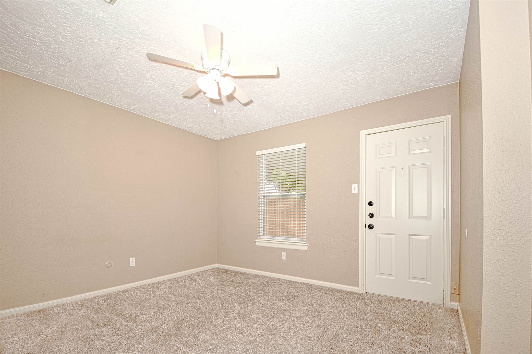 518 Moore Street Tomball, TX 77375 - Photo 13 of 18 The primary bedroom has a walk-in closet and overlooks the fenced backyard and covered porch