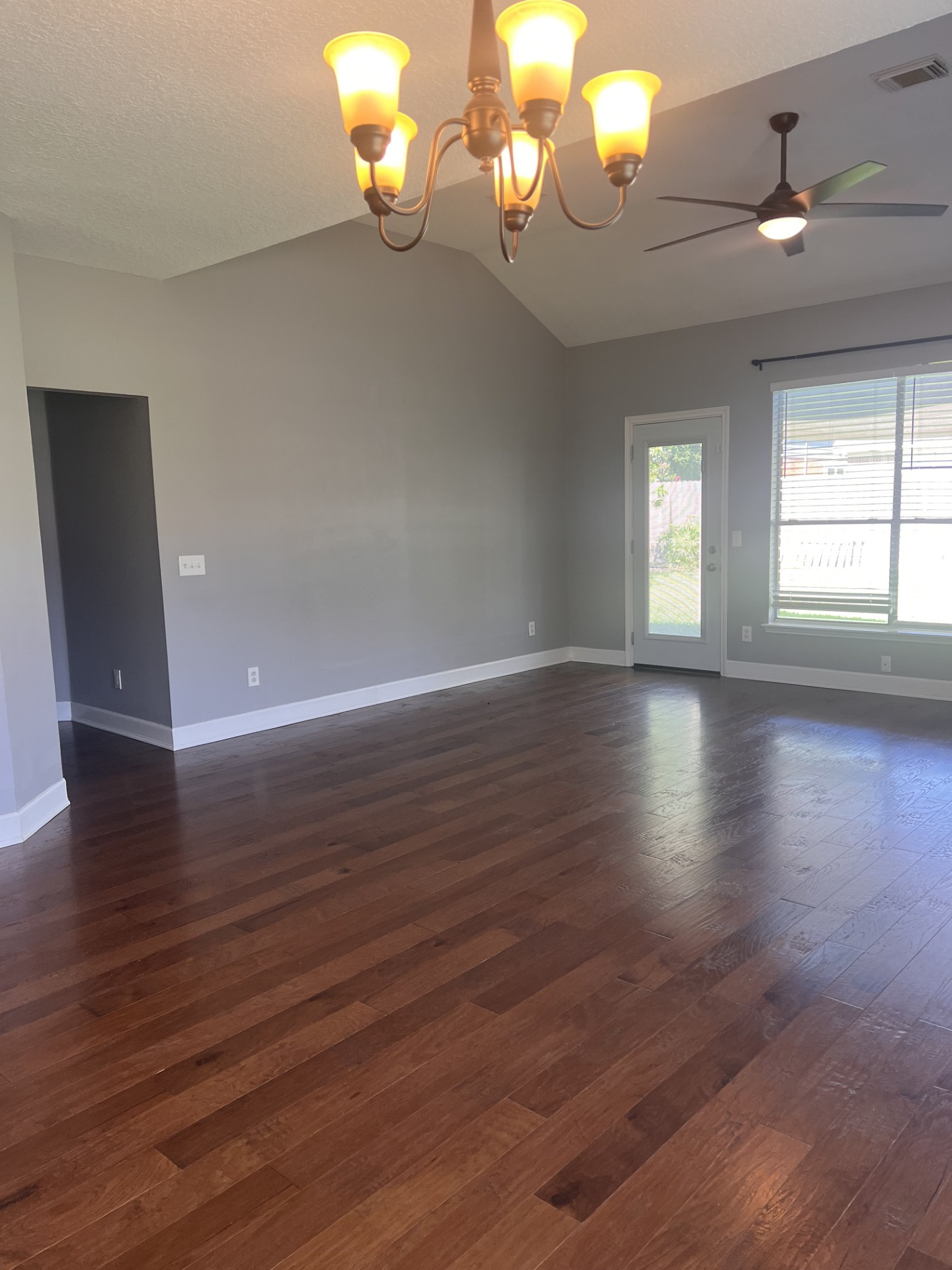 9327 Restover Lane Houston, TX 77064 - Photo 13 of 22 wooden floor in an empty room with a window