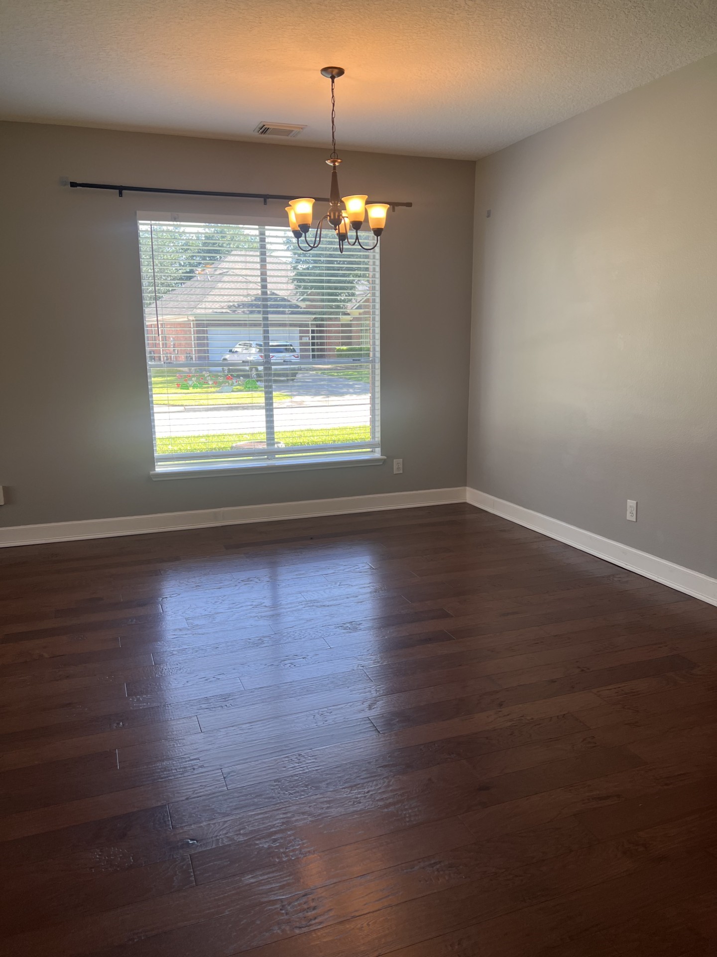 9327 Restover Lane Houston, TX 77064 - Photo 14 of 22 a view of empty room with wooden floor and fan