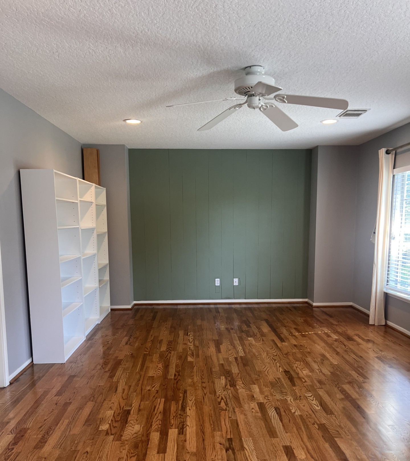 9327 Restover Lane Houston, TX 77064 - Photo 19 of 22 a view of an empty room with wooden floor and a window