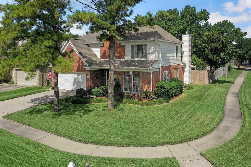 9327 Restover Lane Houston, TX 77064 - Photo 2 of 22 front view of a house with a garden