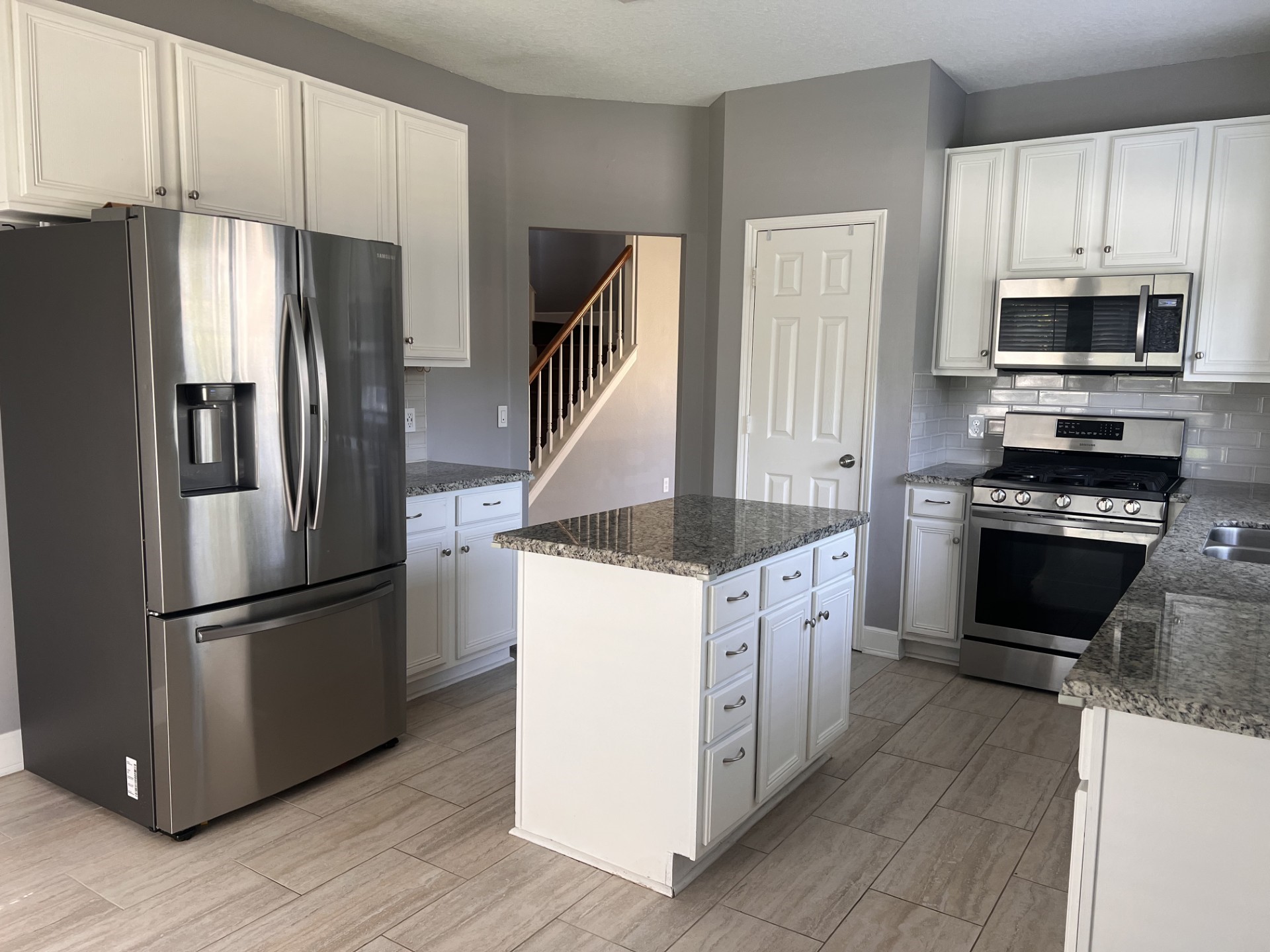9327 Restover Lane Houston, TX 77064 - Photo 10 of 22 a kitchen with stainless steel appliances granite countertop a refrigerator a stove and a sink