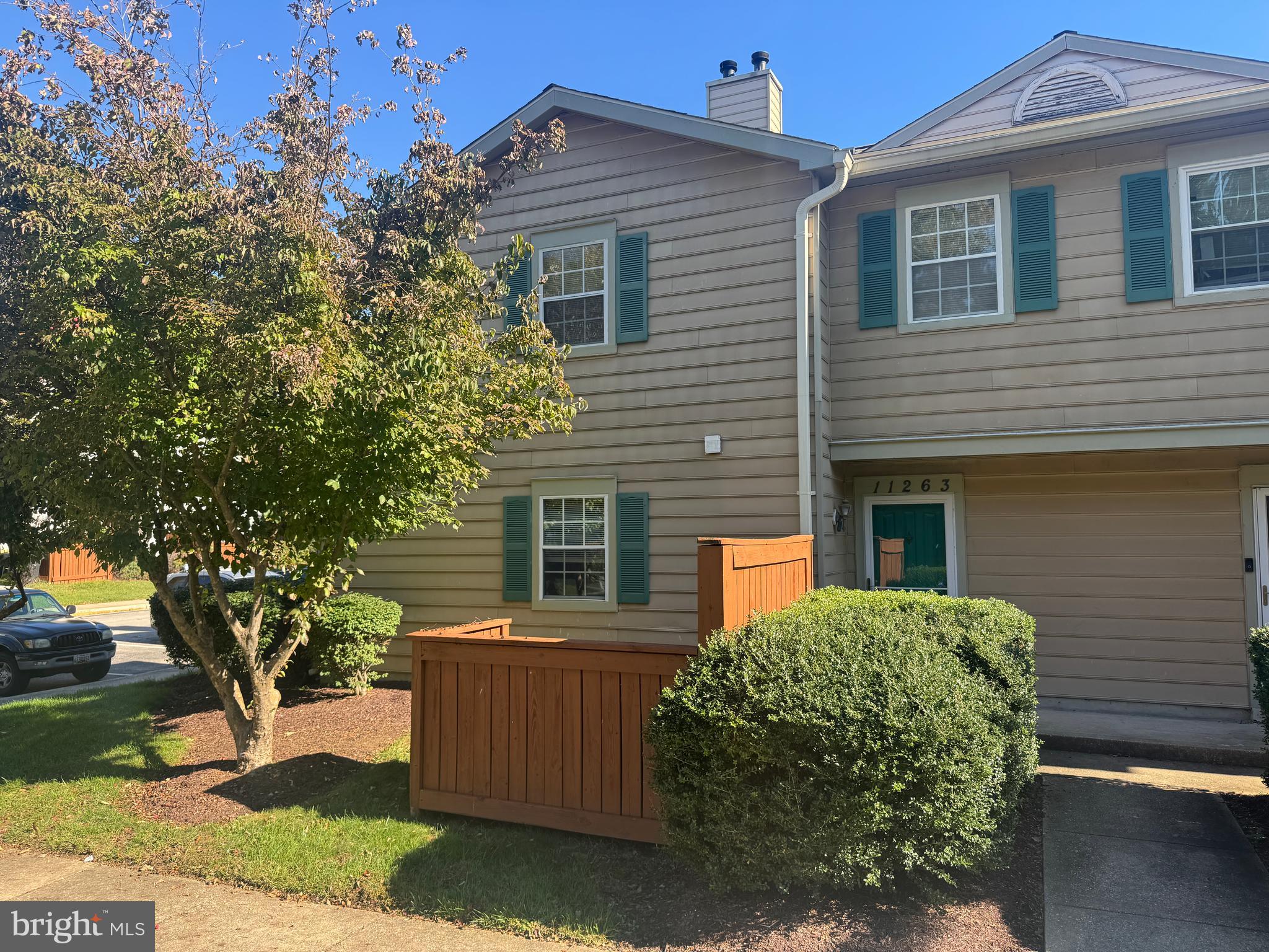 11263 Raging Brook Drive, Unit 253 Bowie, MD 20720 - Photo 1 of 22 a front view of a house with a yard