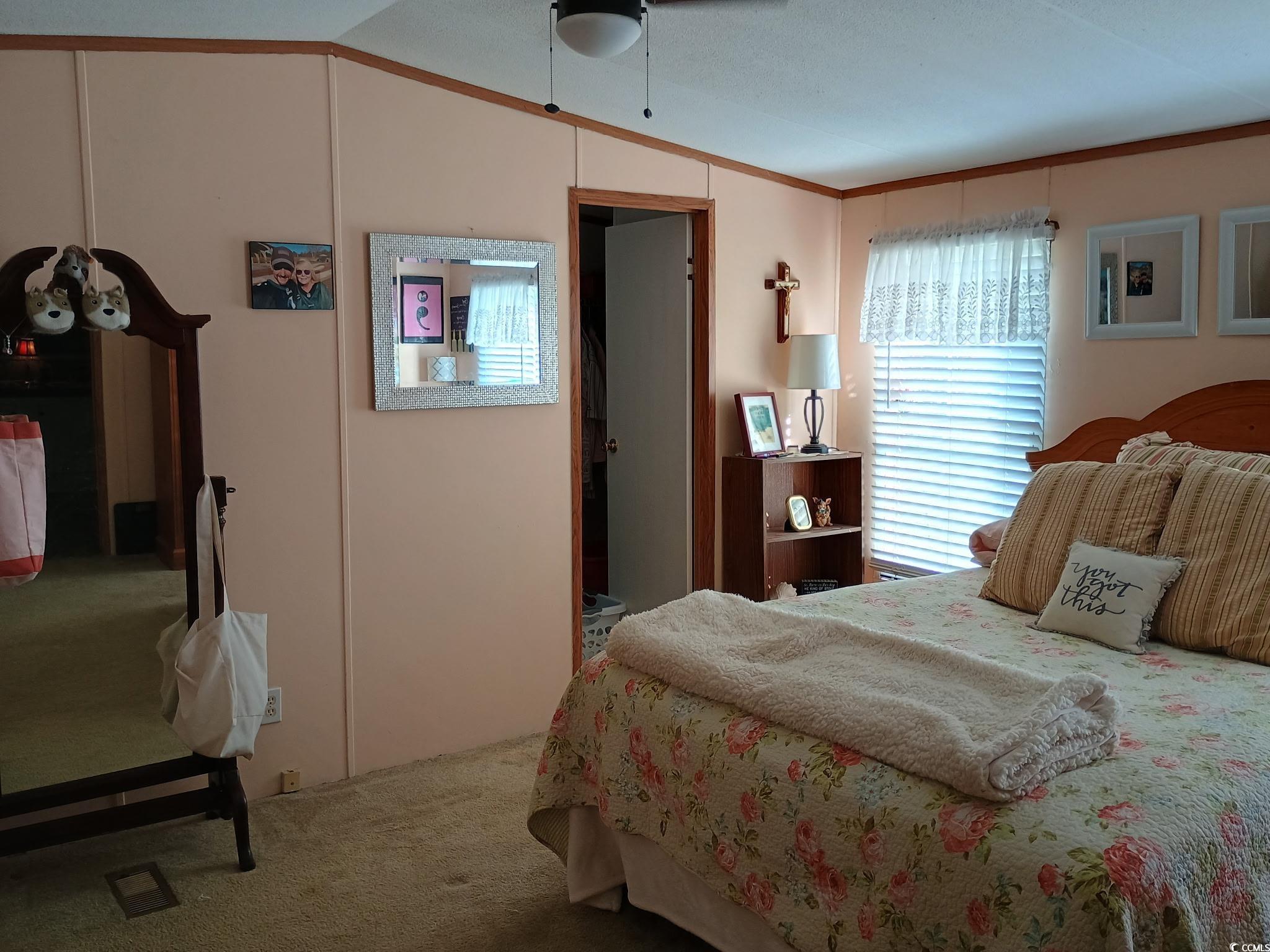 1049 Colonial Lane Conway, SC 29526 - Photo 11 of 27 Carpeted bedroom with a ceiling fan, vaulted ceiling, and ornamental molding