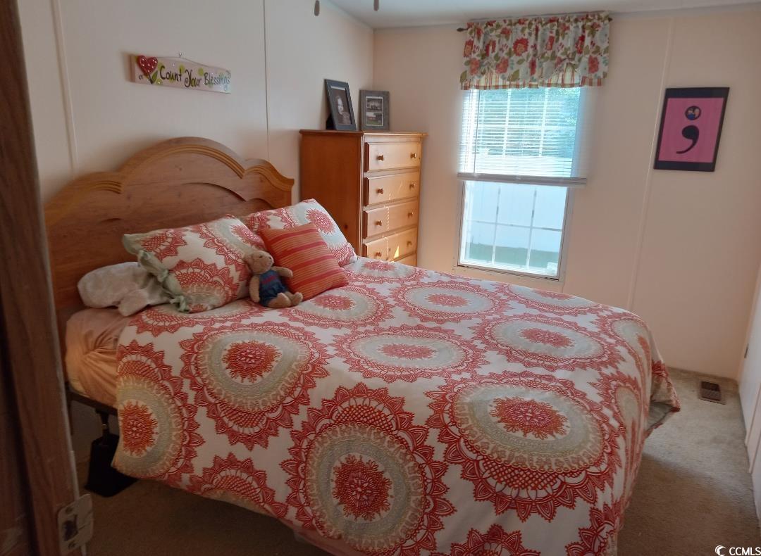 1049 Colonial Lane Conway, SC 29526 - Photo 18 of 27 Bedroom featuring carpet flooring