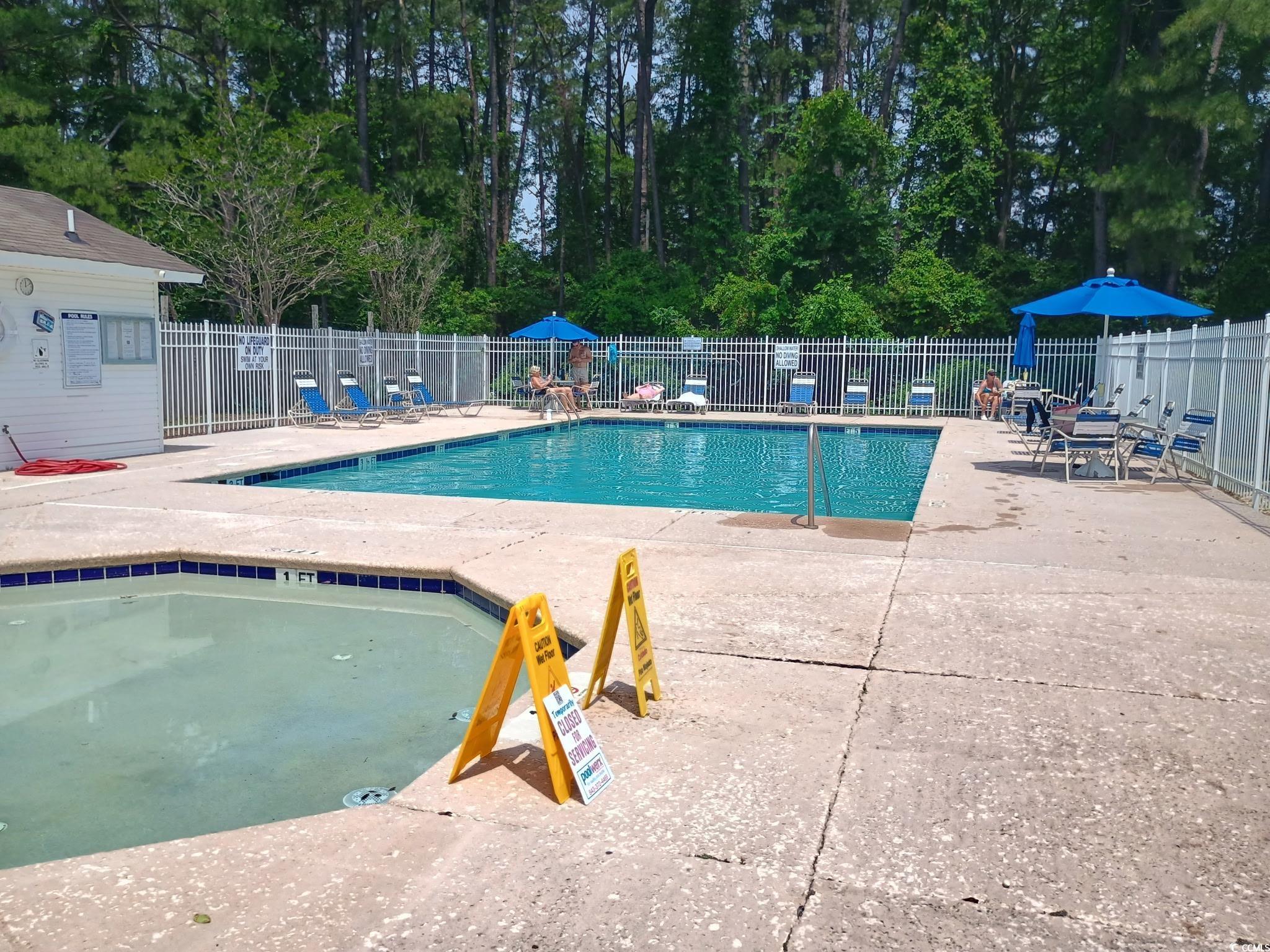 1049 Colonial Lane Conway, SC 29526 - Photo 24 of 27 Community pool featuring a patio area