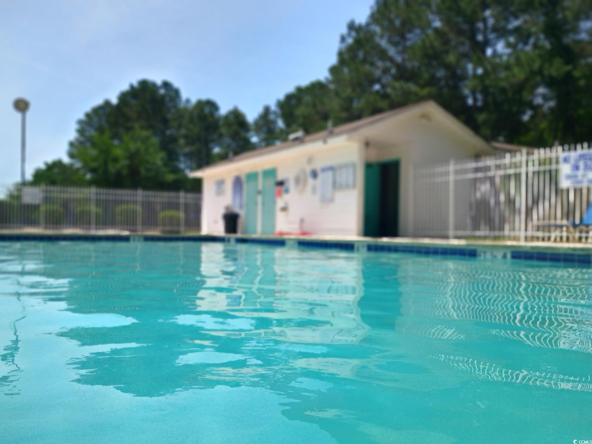 1049 Colonial Lane Conway, SC 29526 - Photo 25 of 27 Community pool with a patio area