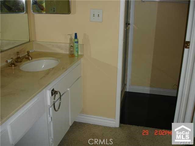 1749 North Rutherford Street Anaheim, CA 92806 - Photo 5 of 10 a bathroom with a sink and a mirror