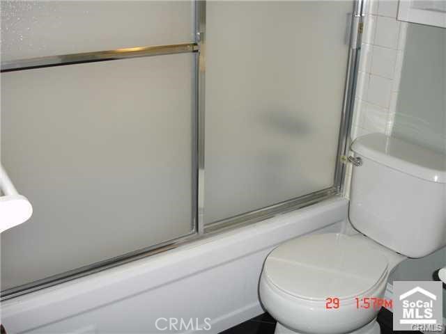 1749 North Rutherford Street Anaheim, CA 92806 - Photo 8 of 10 a bathroom with a toilet and a shower