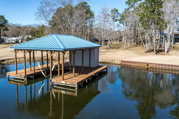 a kitchen with counter top space sink stove and chairs