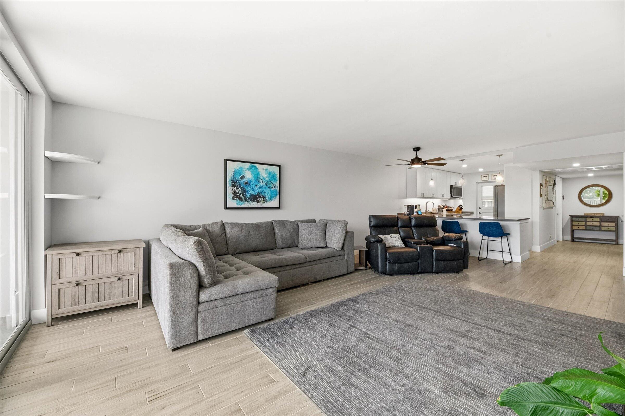 2600 South Course Drive, Unit 610 Pompano Beach, FL 33069 - Photo 13 of 33 a living room with furniture and a wooden floor