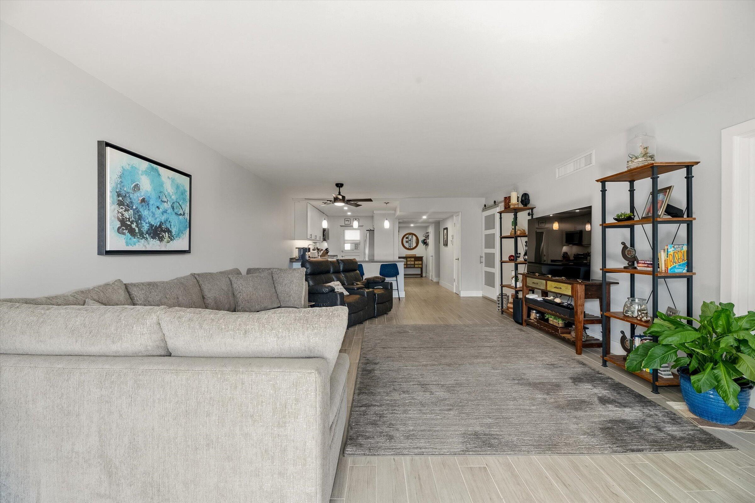 2600 South Course Drive, Unit 610 Pompano Beach, FL 33069 - Photo 14 of 33 a living room with furniture and a flat screen tv