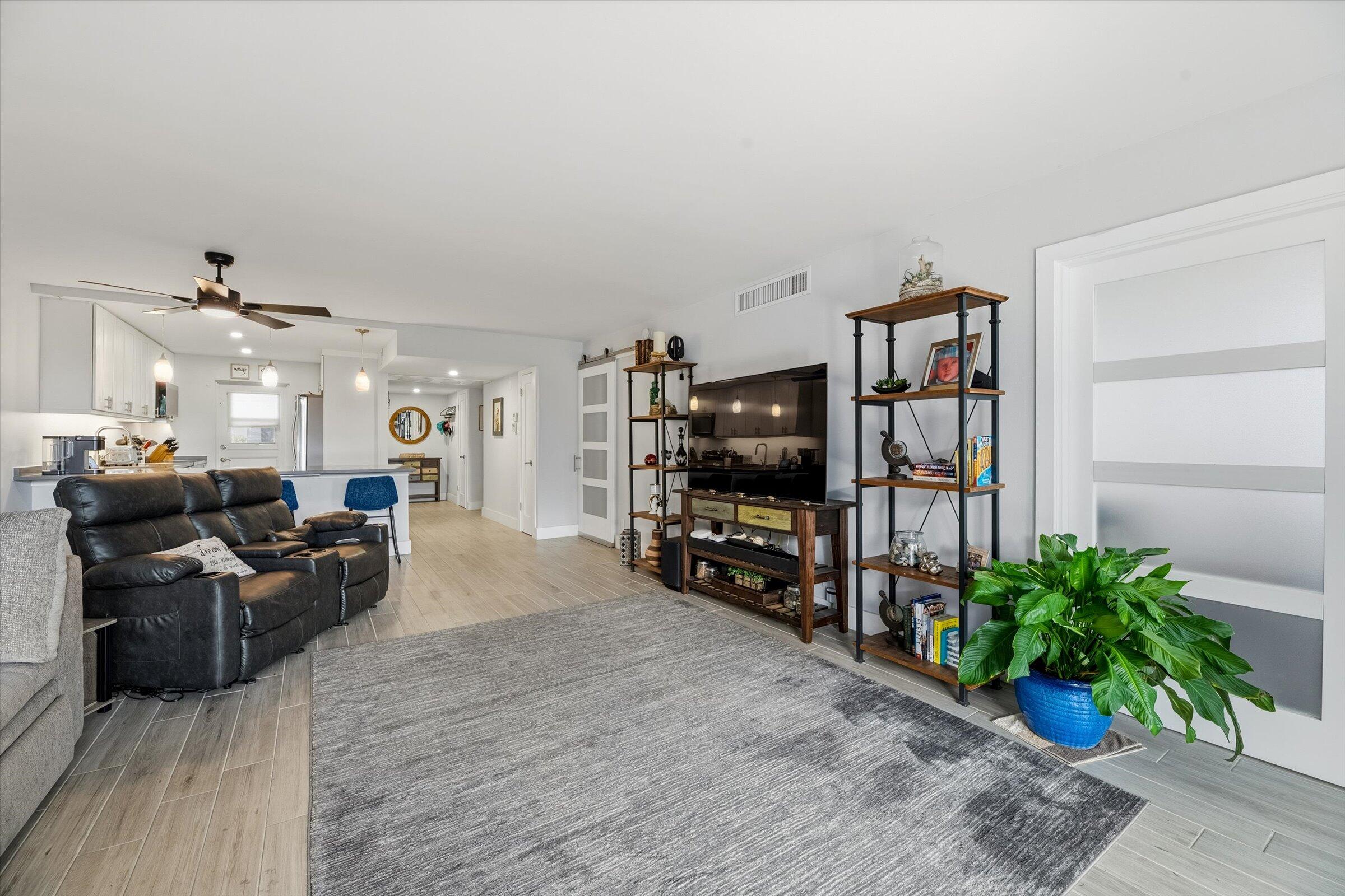 2600 South Course Drive, Unit 610 Pompano Beach, FL 33069 - Photo 15 of 33 a living room with furniture and a flat screen tv