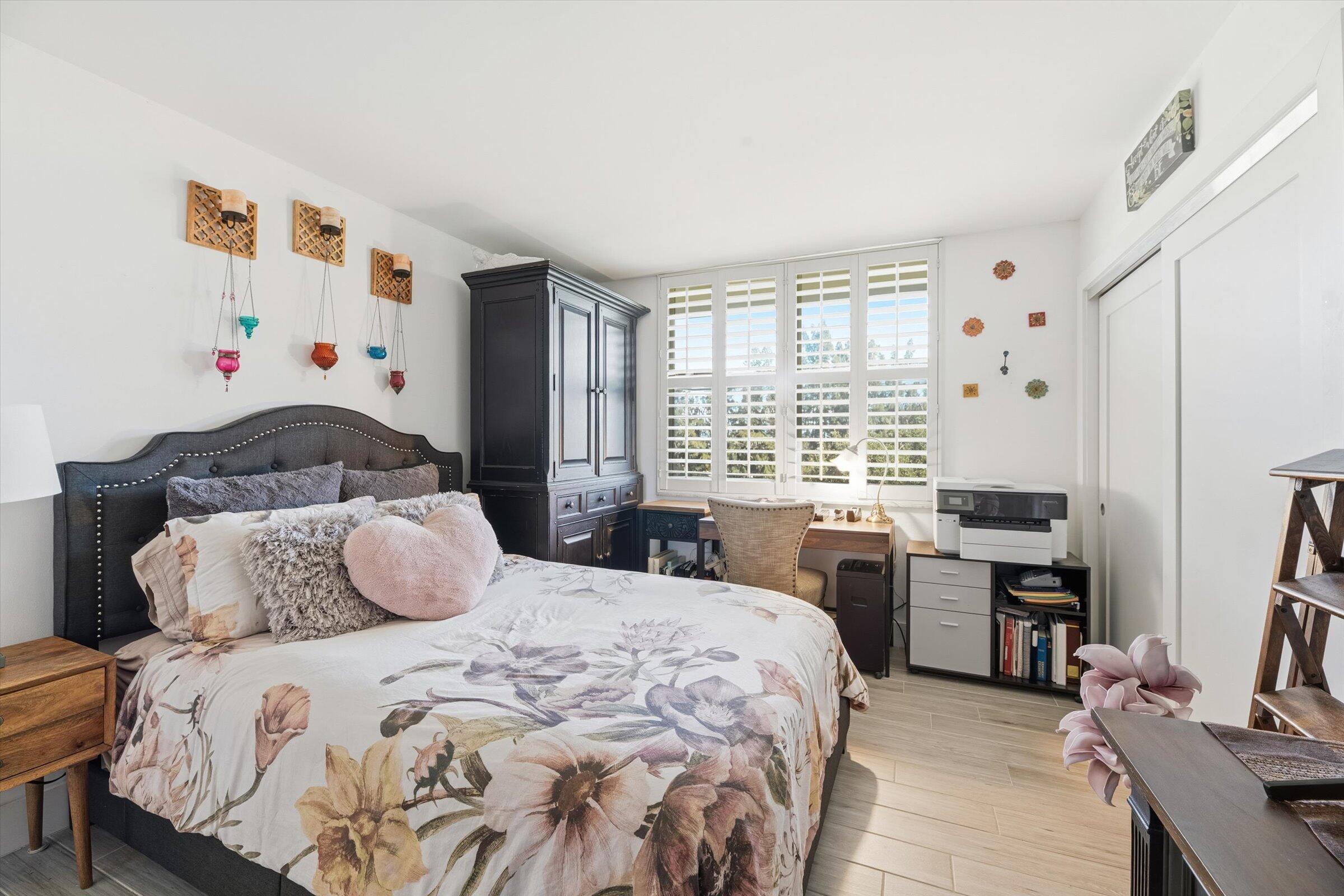 2600 South Course Drive, Unit 610 Pompano Beach, FL 33069 - Photo 20 of 33 a bedroom with a bed and a window