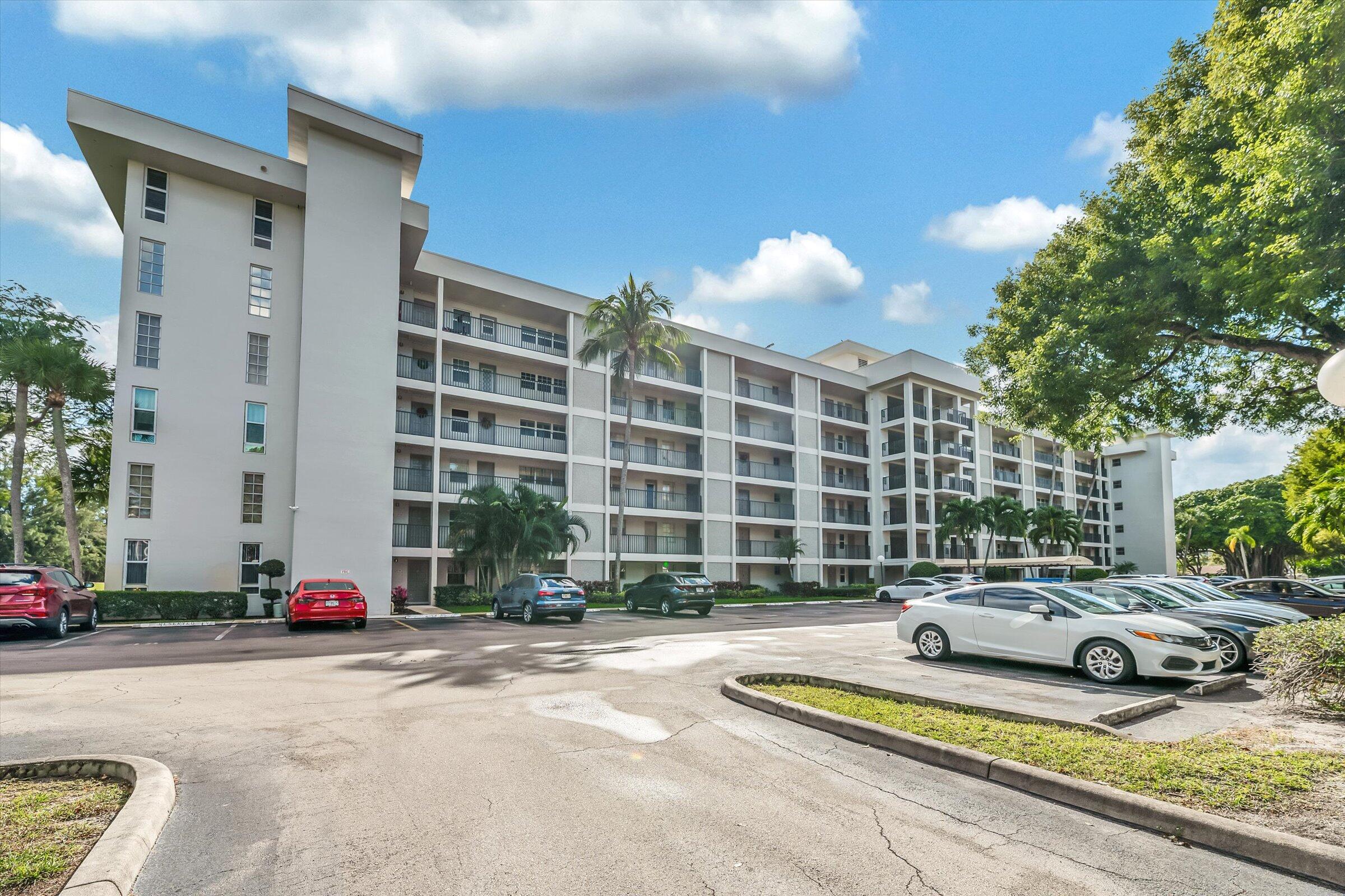 2600 South Course Drive, Unit 610 Pompano Beach, FL 33069 - Photo 2 of 33 a front view of a building with street view