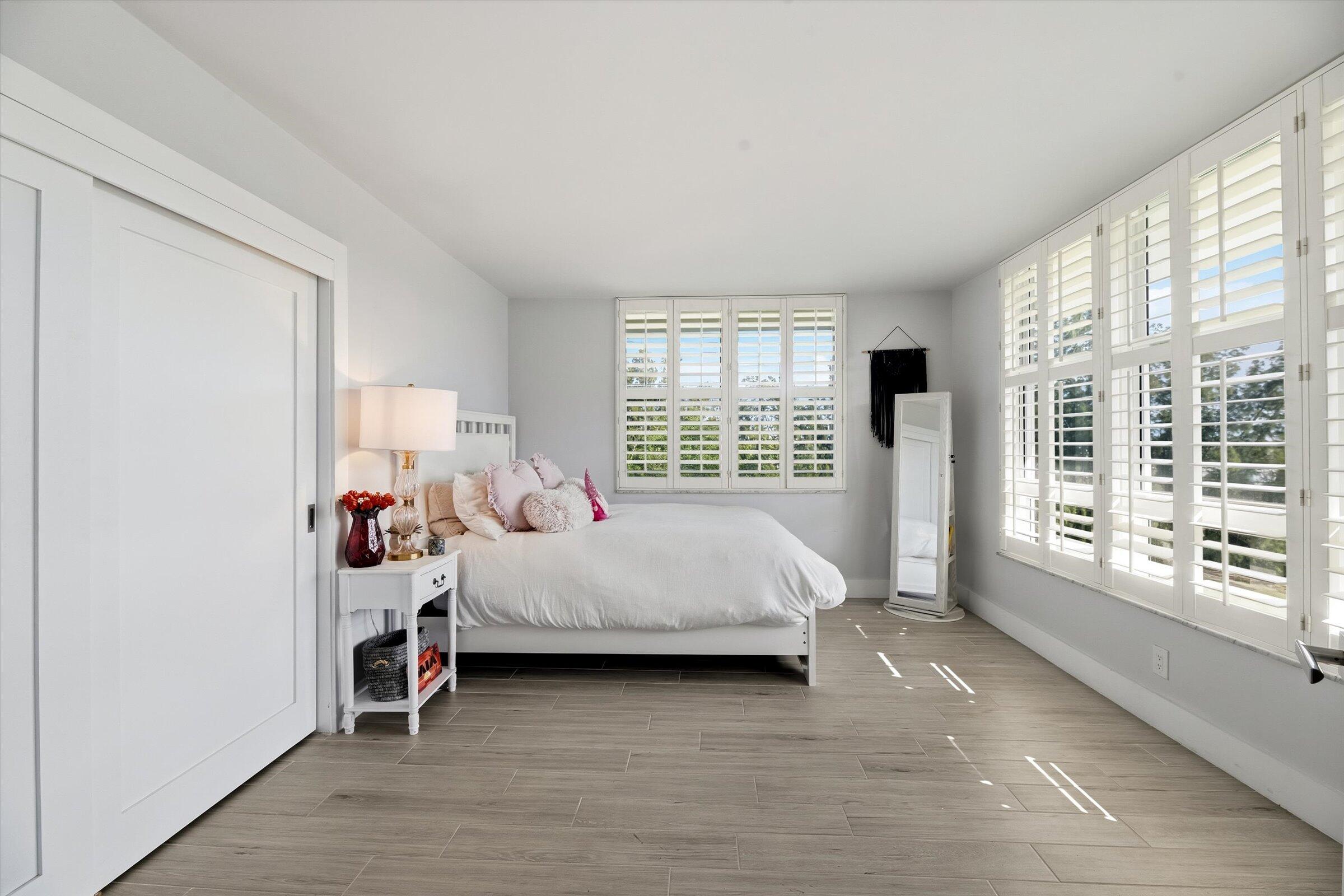 2600 South Course Drive, Unit 610 Pompano Beach, FL 33069 - Photo 23 of 33 a bed room with a bed and a large window