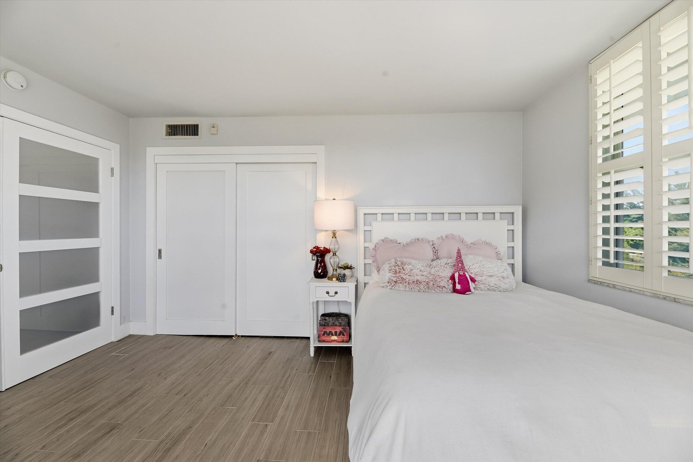 2600 South Course Drive, Unit 610 Pompano Beach, FL 33069 - Photo 25 of 33 a bedroom with a bed and a window