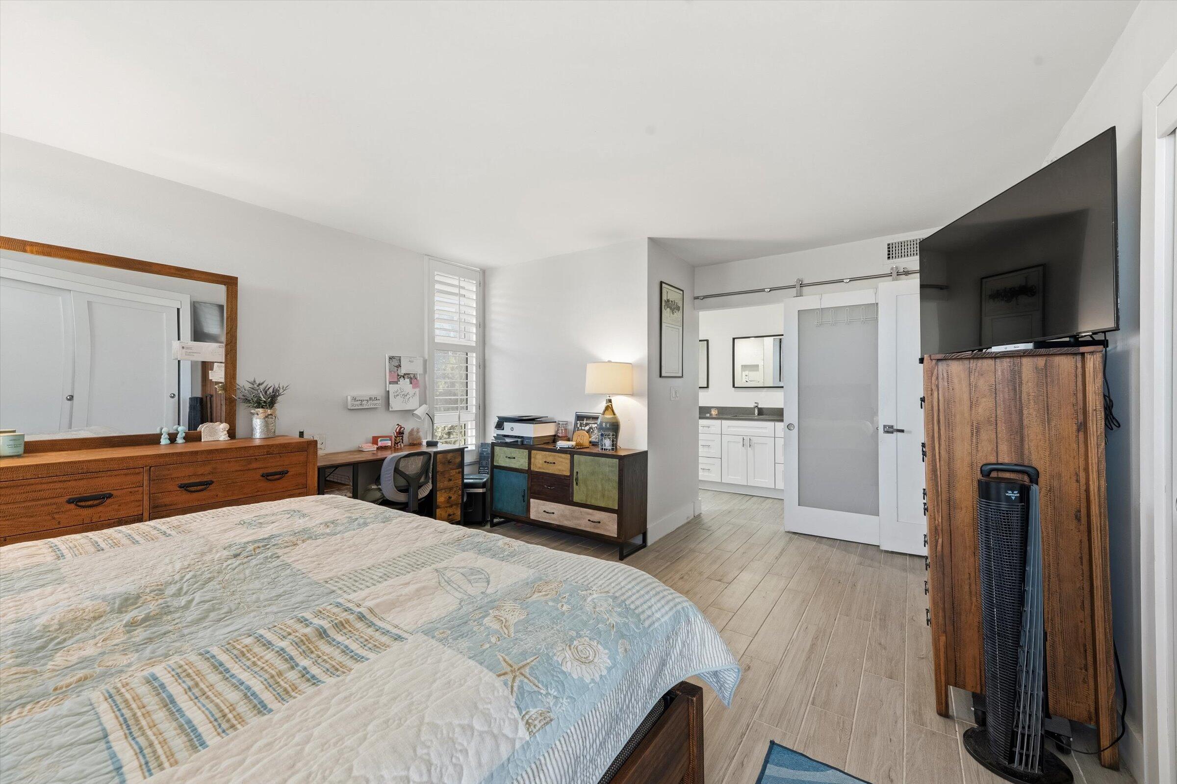 2600 South Course Drive, Unit 610 Pompano Beach, FL 33069 - Photo 30 of 33 a bed room with furniture and a flat screen tv