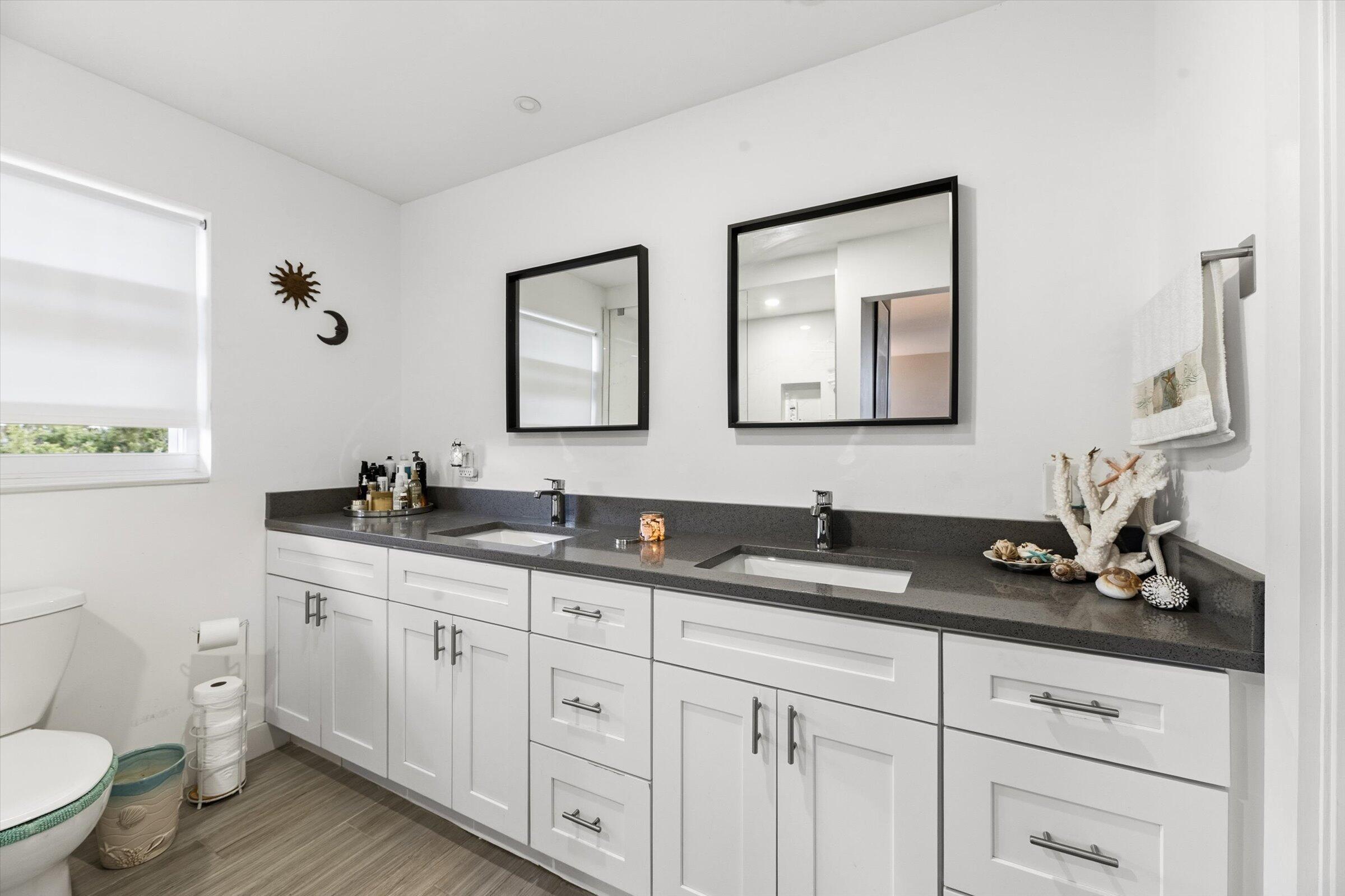 2600 South Course Drive, Unit 610 Pompano Beach, FL 33069 - Photo 32 of 33 a bathroom with a granite countertop sink mirror and toilet