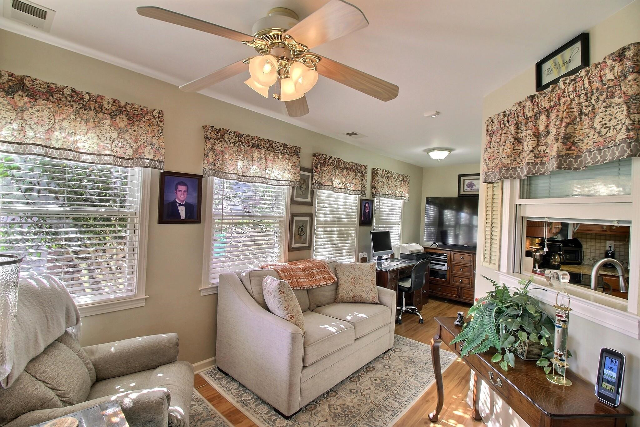 798 Early Earner Cove Collierville, TN 38017 - Photo 11 of 26 a living room with furniture a fireplace and a chandelier