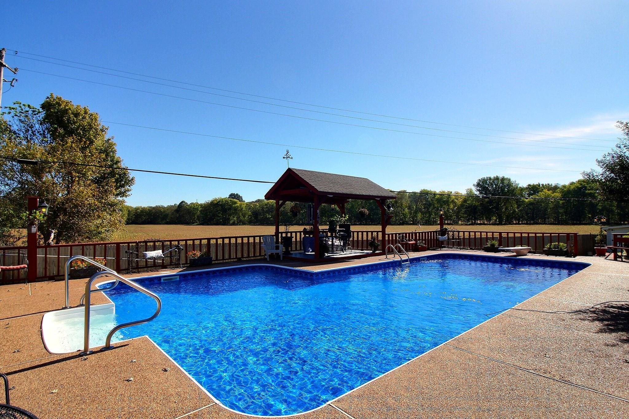 798 Early Earner Cove Collierville, TN 38017 - Photo 2 of 26 a view of swimming pool with seating space and trees