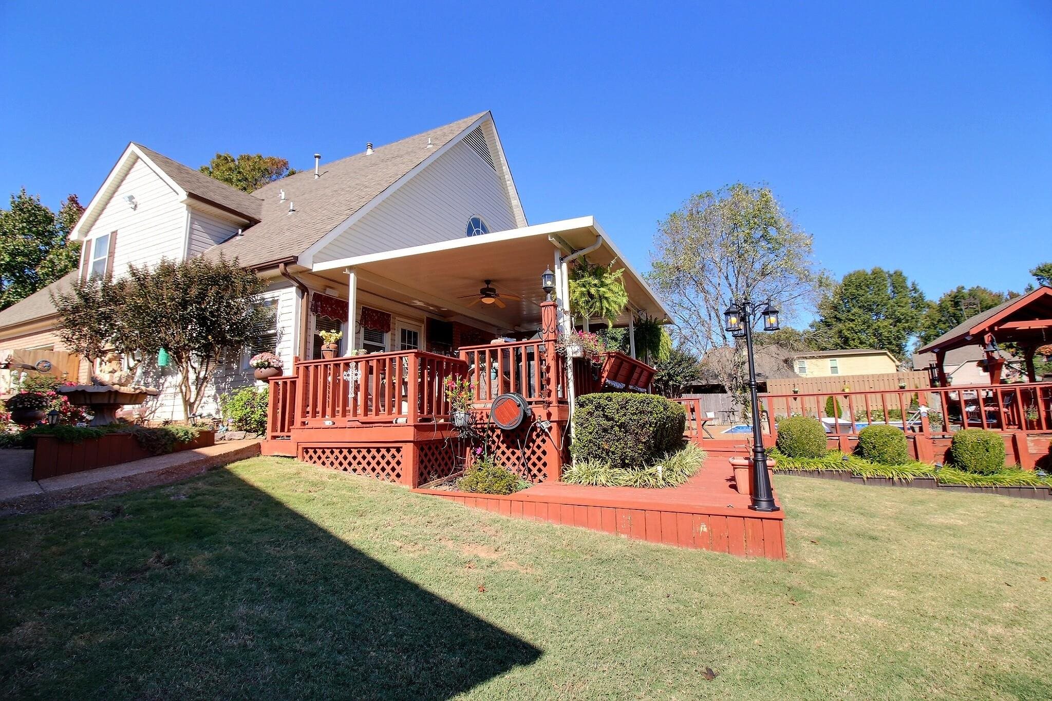 798 Early Earner Cove Collierville, TN 38017 - Photo 22 of 26 a view of a house with a yard porch and sitting area