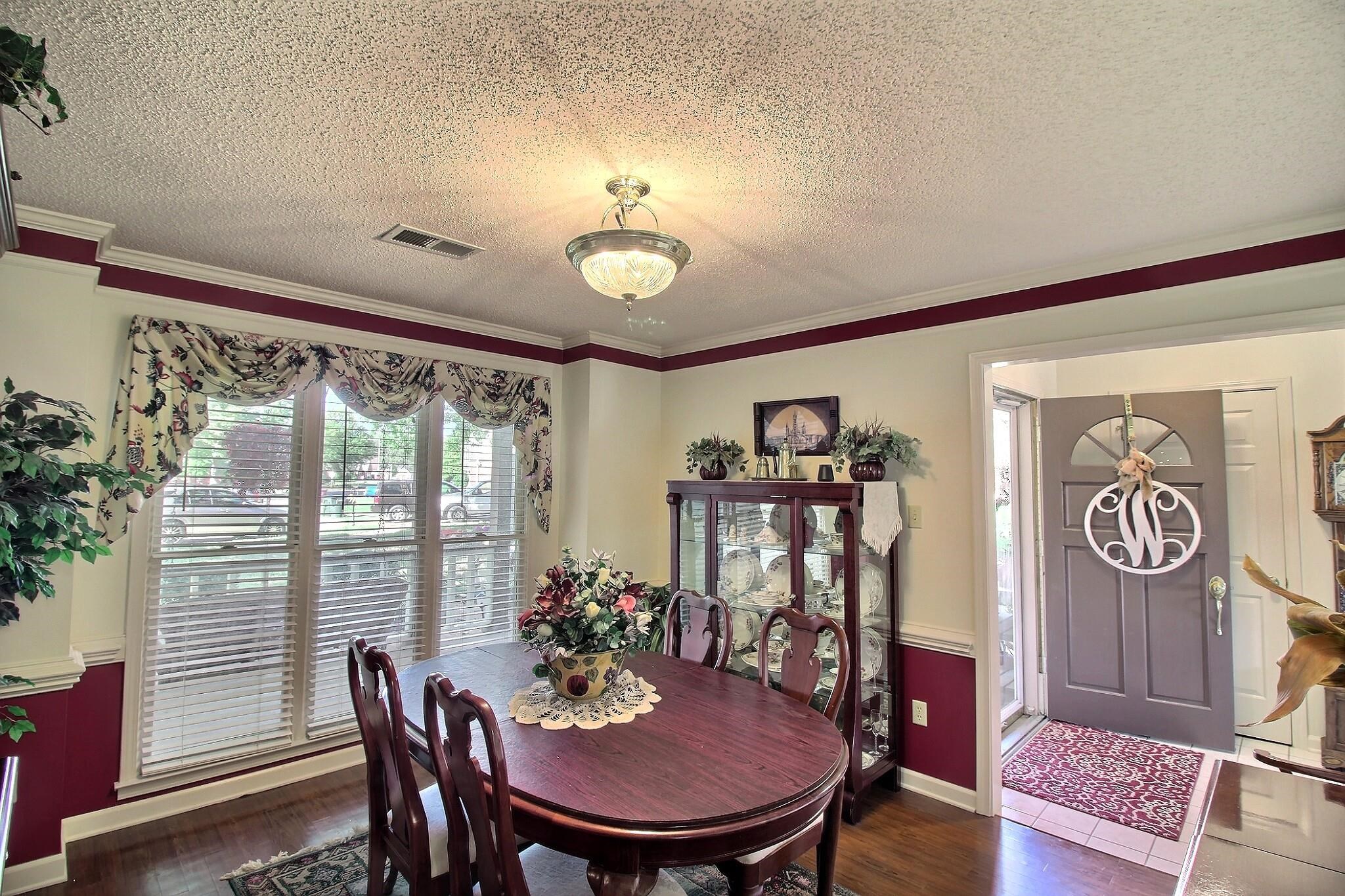 798 Early Earner Cove Collierville, TN 38017 - Photo 7 of 26 a view of a dining room with furniture window and wooden floor