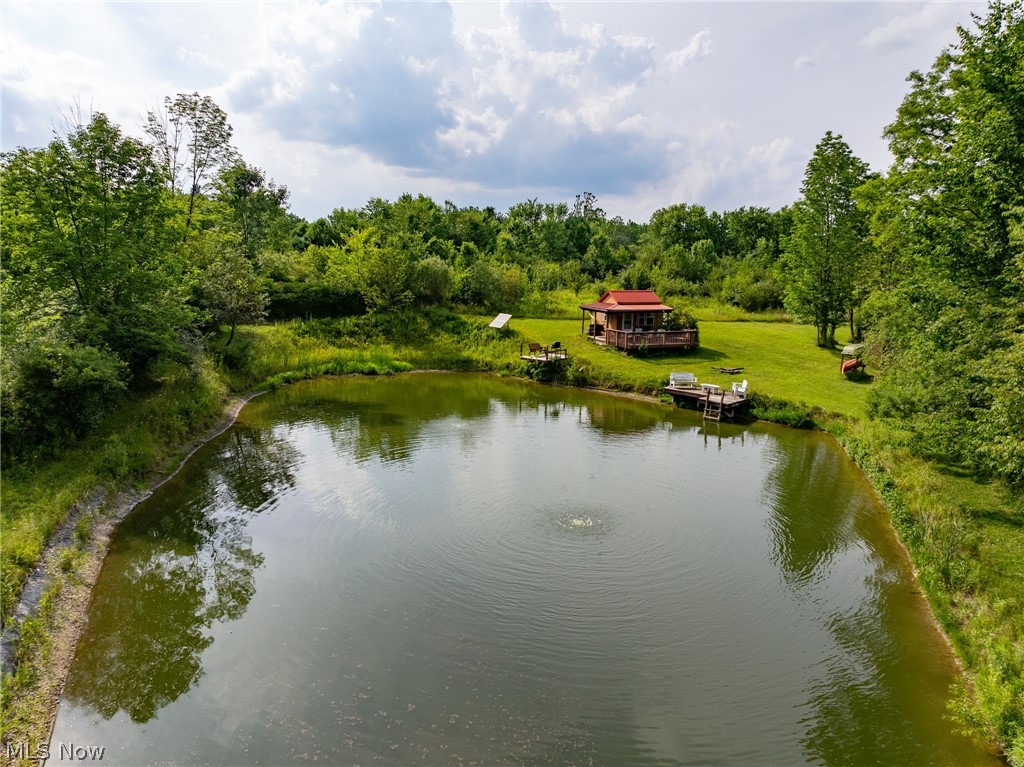 Bennett Road North Royalton, OH 44133 - Photo 2 of 26 Private pond featuring a fountain, two docks, and surrounding green space