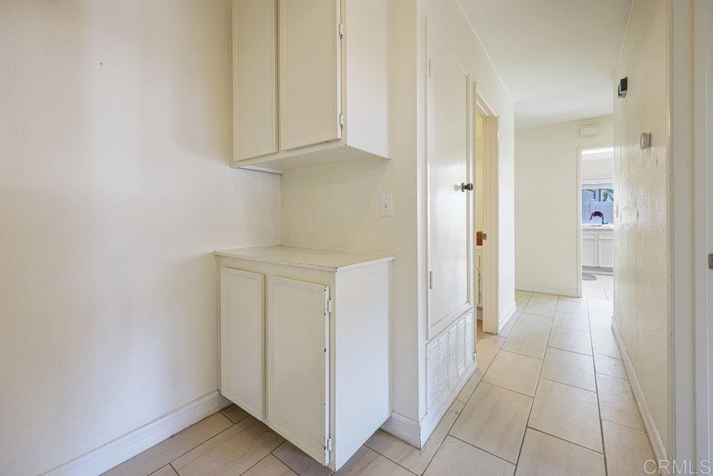 10385 Seth Way Santee, CA 92071 - Photo 26 of 33 a view of a hallway with closet and cabinet
