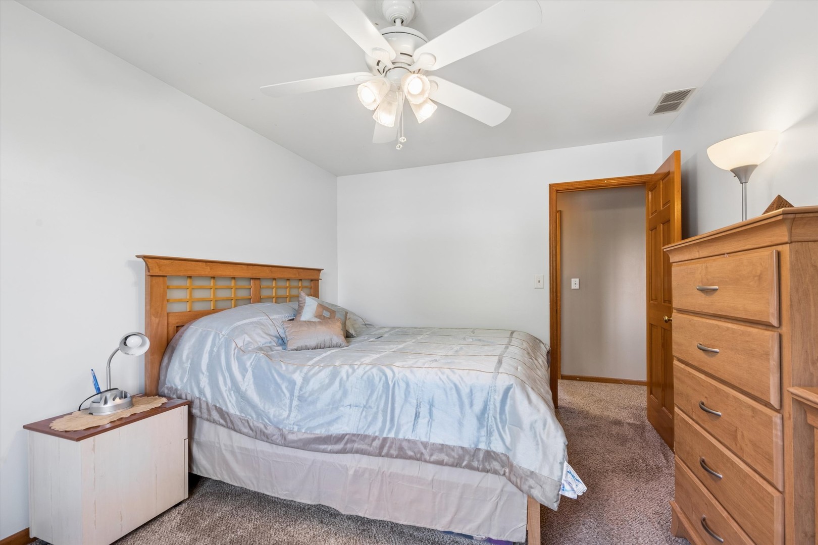 2142 North Summit Street Wheaton, IL 60187 - Photo 24 of 35 a bedroom with a bed and a dresser