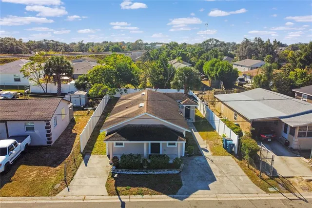 a aerial view of a house with a lake view