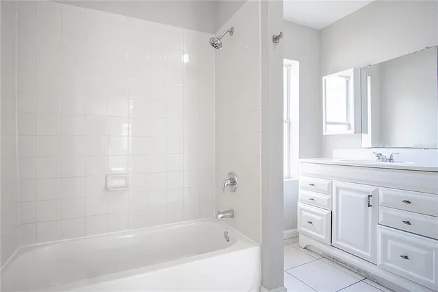 a bathroom with a sink vanity and a mirror