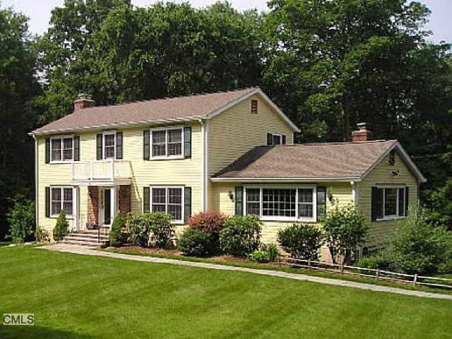 350 Webbs Hill Road Stamford, CT 06903 - Photo 1 of 1 a front view of a house with a yard