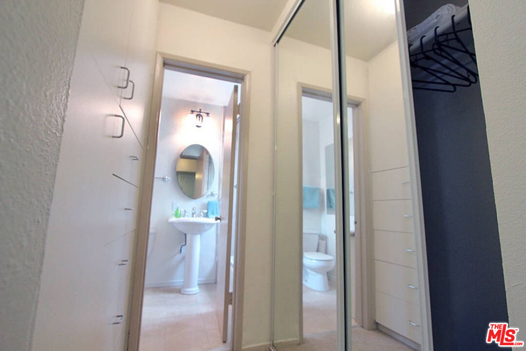 3005 Ocean Front Walk, Unit E Venice, CA 90291 - Photo 5 of 6 a bathroom with a mirror