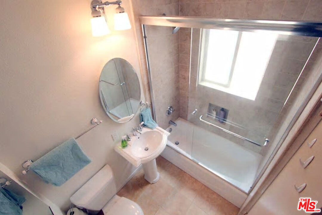3005 Ocean Front Walk, Unit E Venice, CA 90291 - Photo 6 of 6 a bathroom with a sink mirror bathtub and toilet