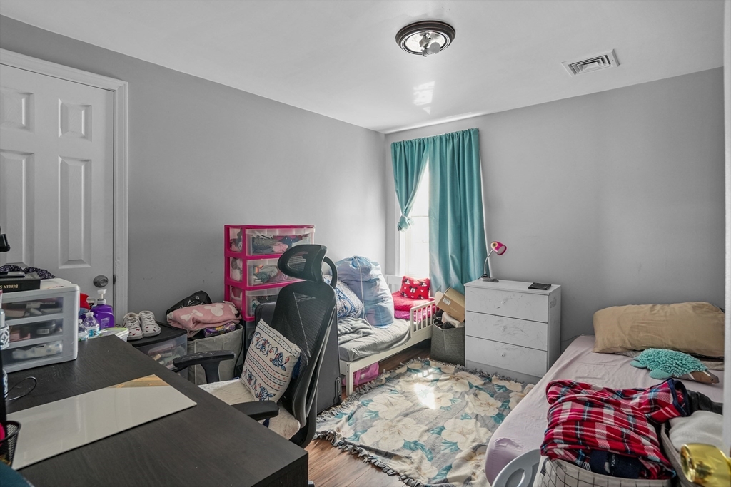 1792 Pleasant Street Fall River, MA 02723 - Photo 17 of 32 a bedroom with furniture and a window