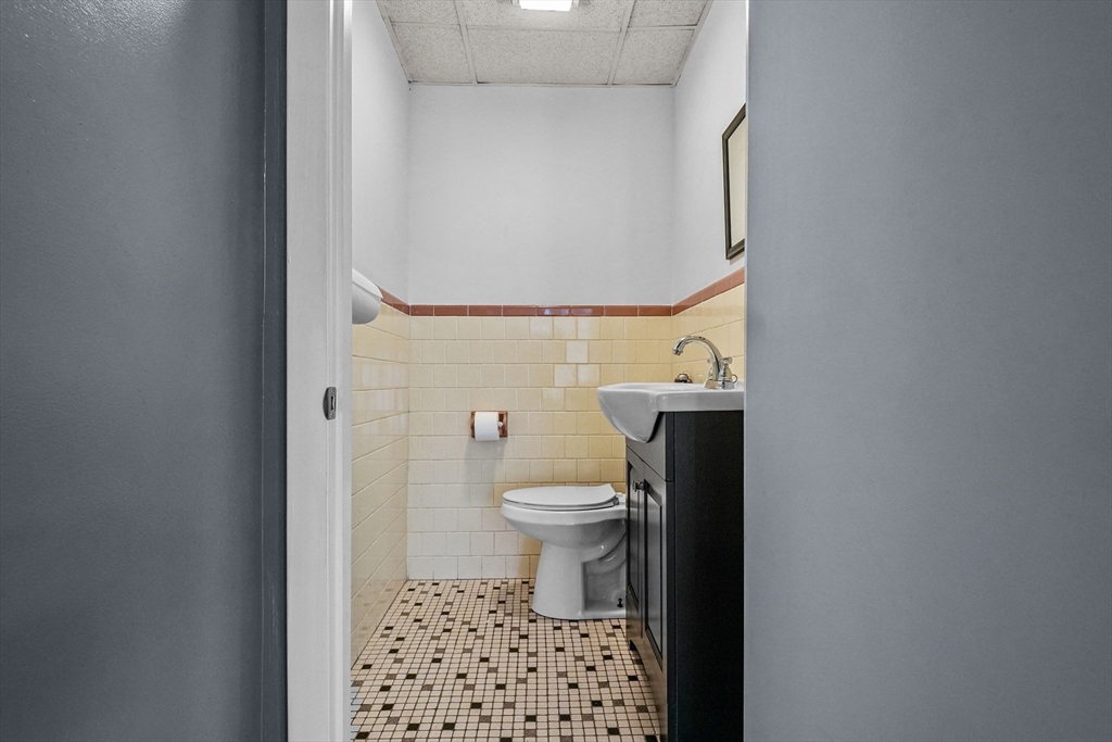 1792 Pleasant Street Fall River, MA 02723 - Photo 24 of 32 a bathroom with a toilet and a shower