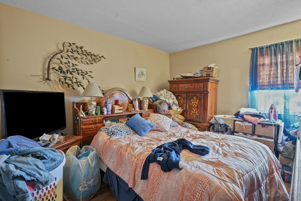 1792 Pleasant Street Fall River, MA 02723 - Photo 6 of 32 a bedroom with two beds and a flat screen tv