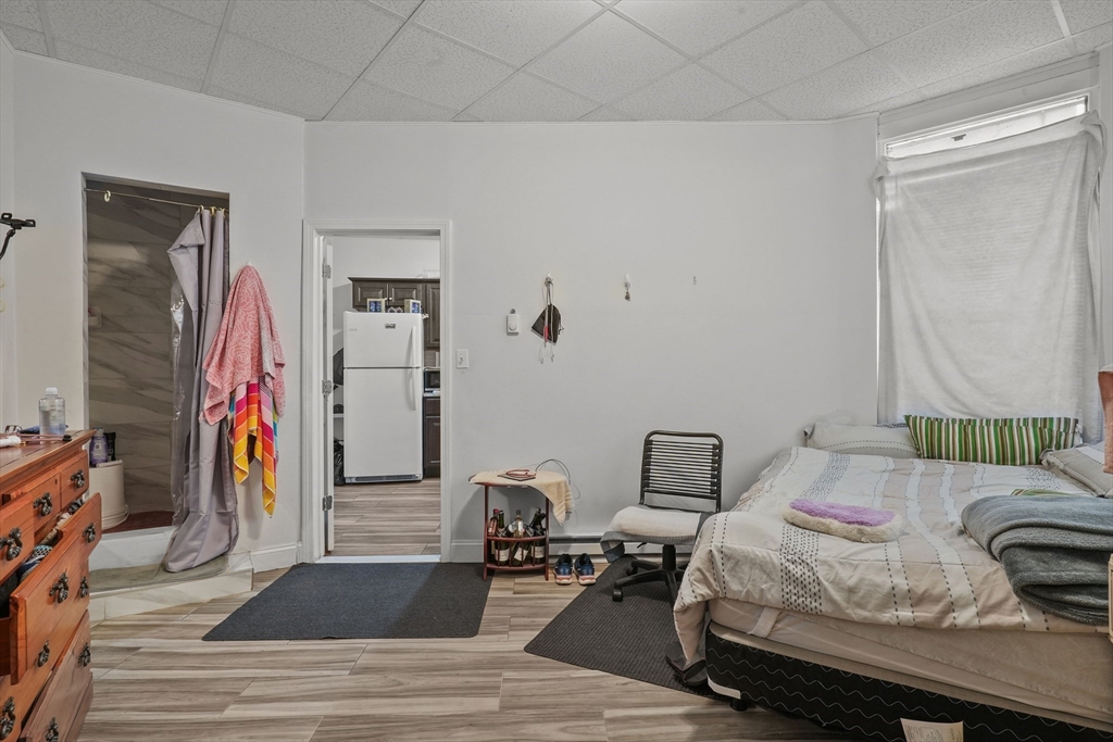 1792 Pleasant Street Fall River, MA 02723 - Photo 10 of 32 a bedroom with a bed and a window