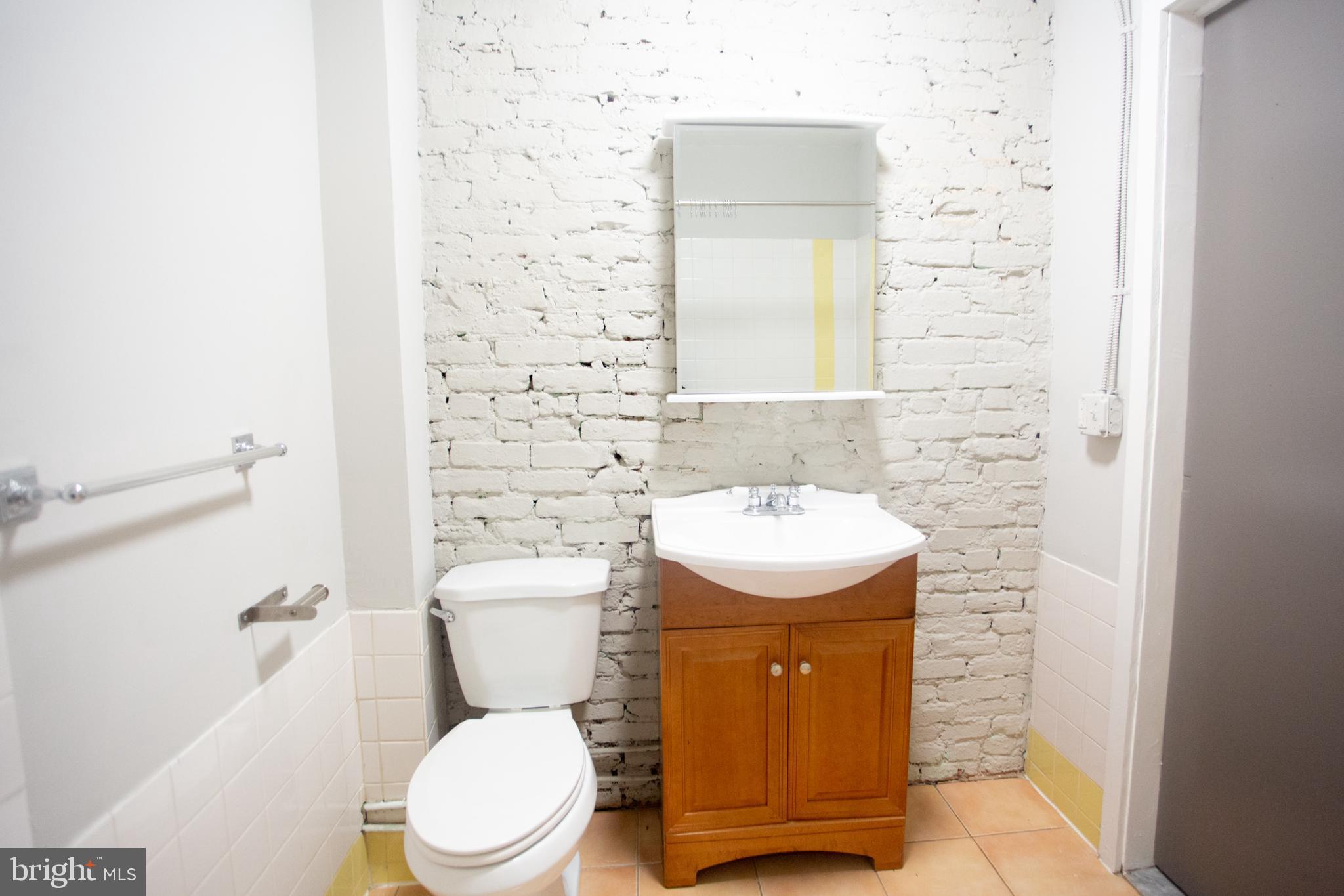 715 South 3rd Street, Unit 204 Philadelphia, PA 19147 - Photo 13 of 28 a bathroom with a sink toilet and shower