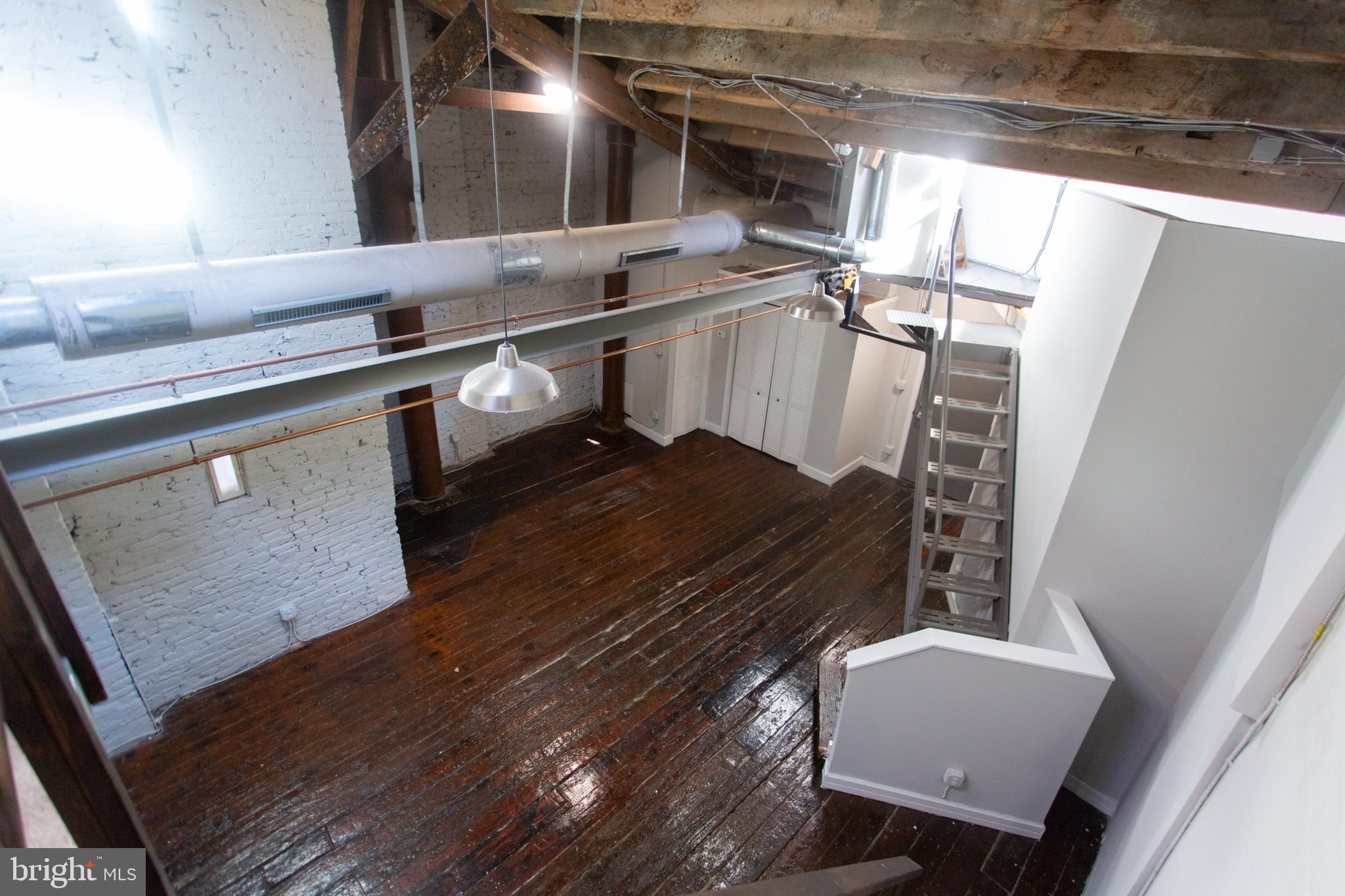 715 South 3rd Street, Unit 204 Philadelphia, PA 19147 - Photo 22 of 28 a living room with chairs