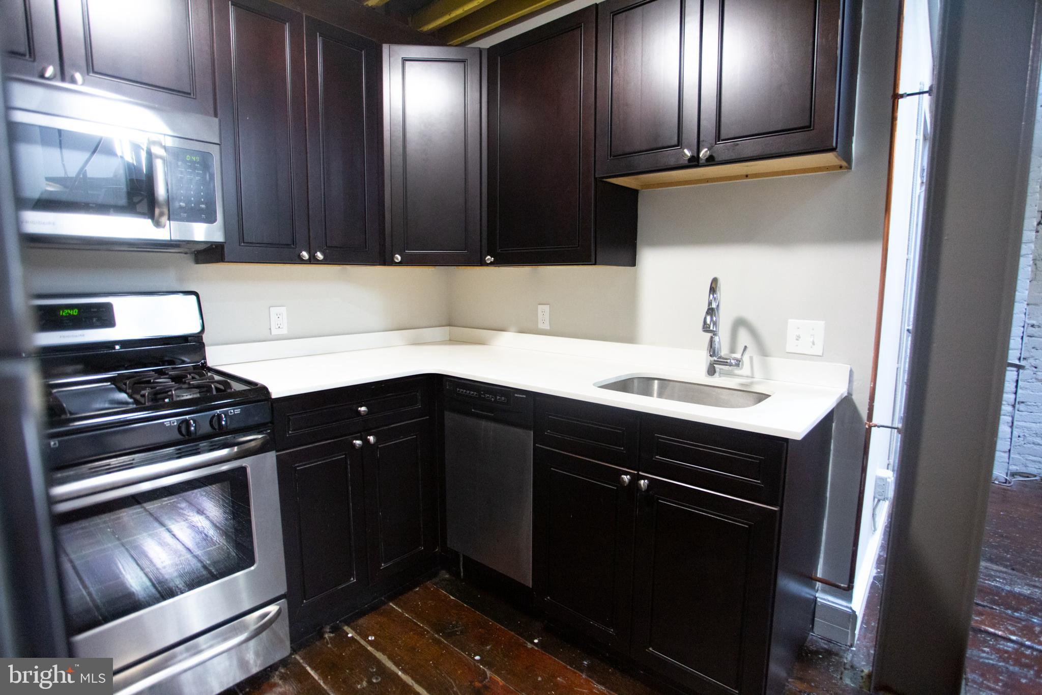 715 South 3rd Street, Unit 204 Philadelphia, PA 19147 - Photo 10 of 28 a kitchen with sink and cabinets