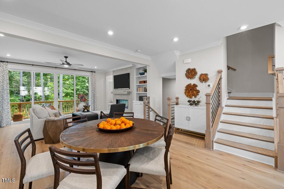 4713 Mint Leaf Lane Raleigh, NC 27612 - Photo 12 of 43 a view of a dining room with furniture and wooden floor