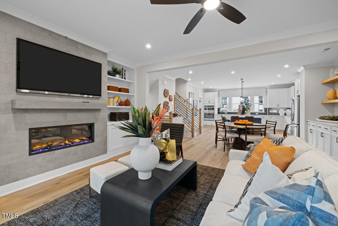 4713 Mint Leaf Lane Raleigh, NC 27612 - Photo 21 of 43 a living room with furniture fireplace and flat screen tv